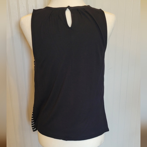 Elle size small black with white stripes on the front and a button in back - Picture 2 of 3